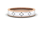 two-tone gold ring with diamond accents on a white background