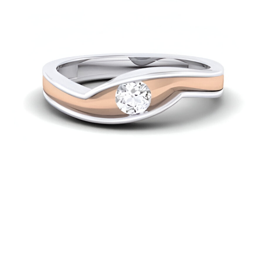 Two-tone ring with a diamond on a white background