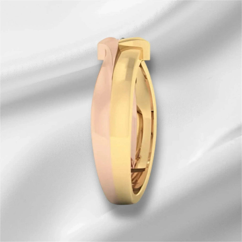 Gold diamond ring on a light gray background
