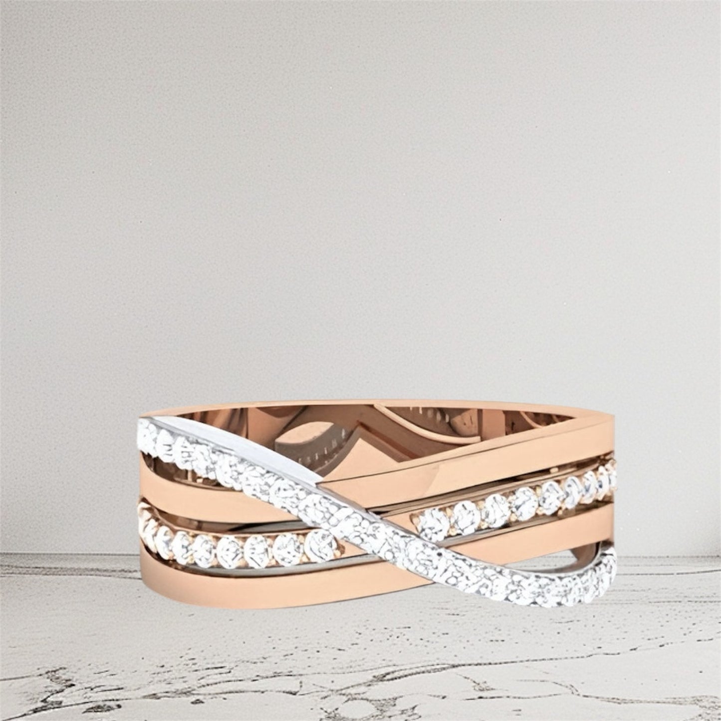 Rose gold and white gold ring with diamond accents on a light gray background.
