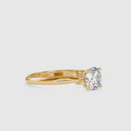 Gold ring with a solitaire lab grown diamond on a white background shown from 360 degree angle