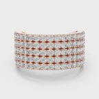 Rose gold ring with real diamond accents is rotating horizontally on a white surface.