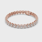 Rose gold bracelet with real diamonds is rotating horizontally on a white surface.