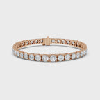 Rose gold bracelet with real diamond accents is rotating horizontally on a white surface.