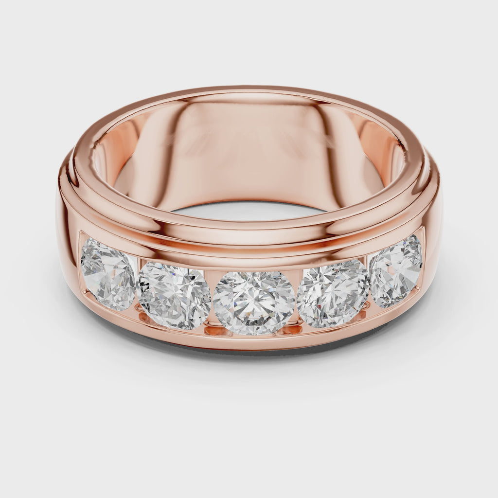 Rose gold ring with five round diamonds is rotating horizontally on a white surface, showing it from every angle.