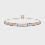 Rose gold bracelet with real diamonds accents is rotating parallel to the white surface.