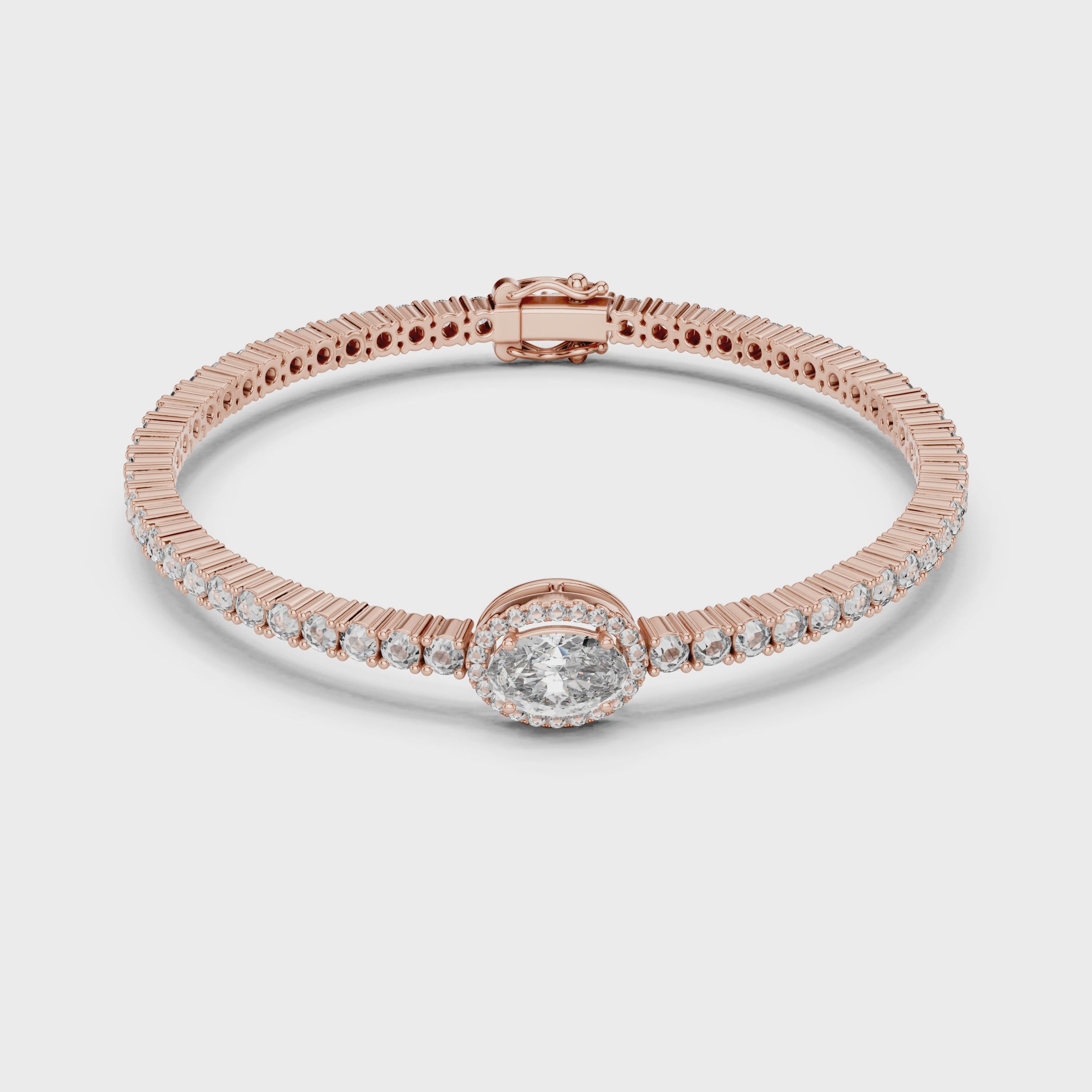 Rose gold bracelet with real diamonds is rotating parallel to the white surface.