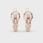 pair of diamond earrings for women is displaying on a white background and white surface.