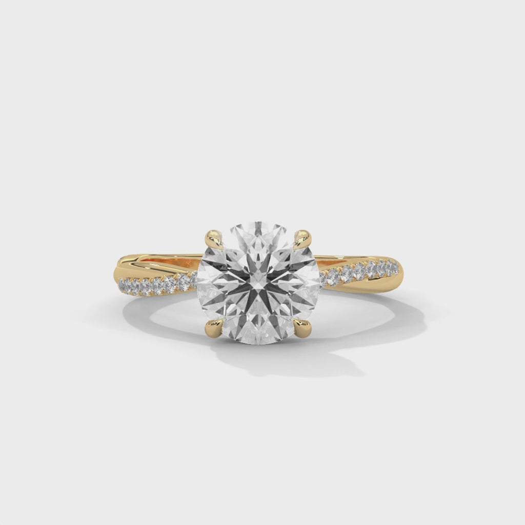 Gold and lab grown diamond ring on a white background, displayed from the 360 degree angle.