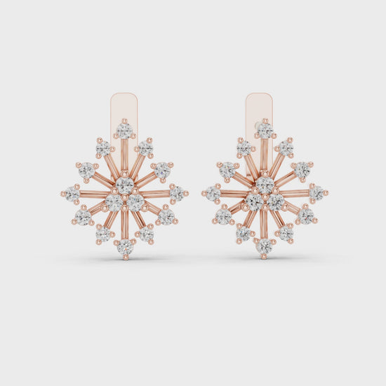 women's floral style diamond and gold earrings are shown from 360 degree angle against a white background.