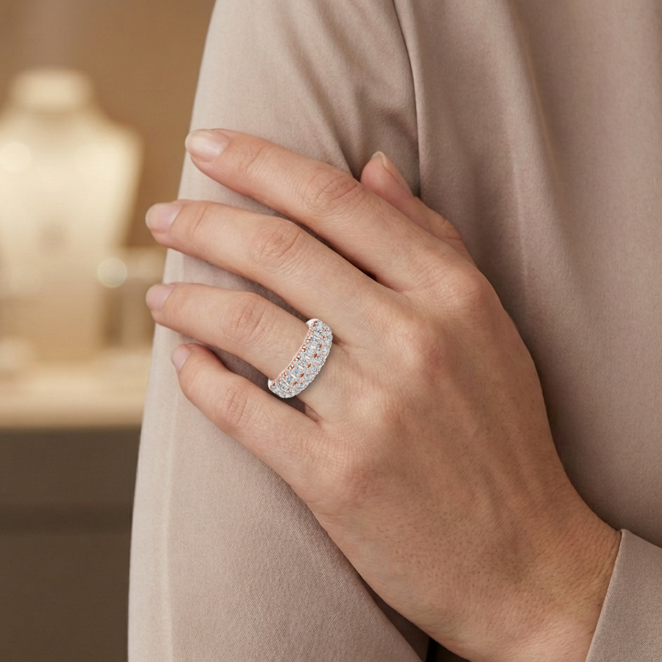 Hand wearing a real diamond ring with a blurred background