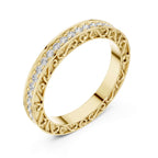 Gold ring with natural diamond accents on a white background