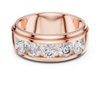 Rose gold ring with diamonds on a white background
