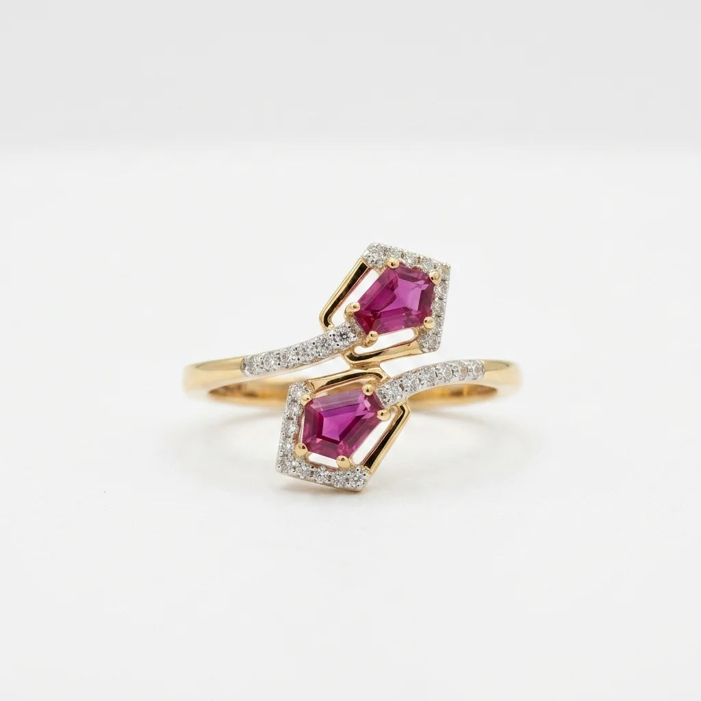 A gold ring with two diamond-paved halos surrounding pink gemstones, displayed on a clean white background.