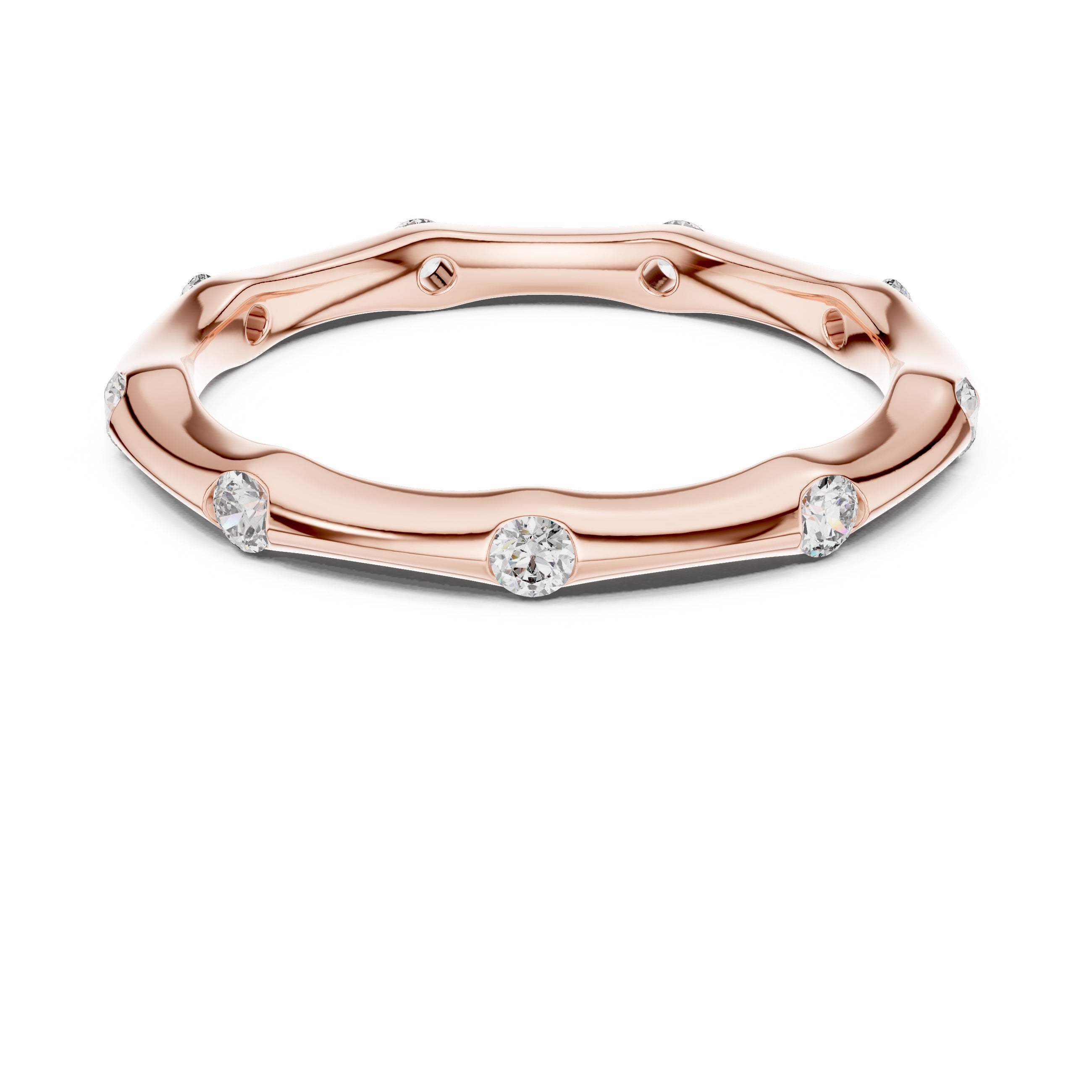 Rose gold ring with diamond accents on a white background