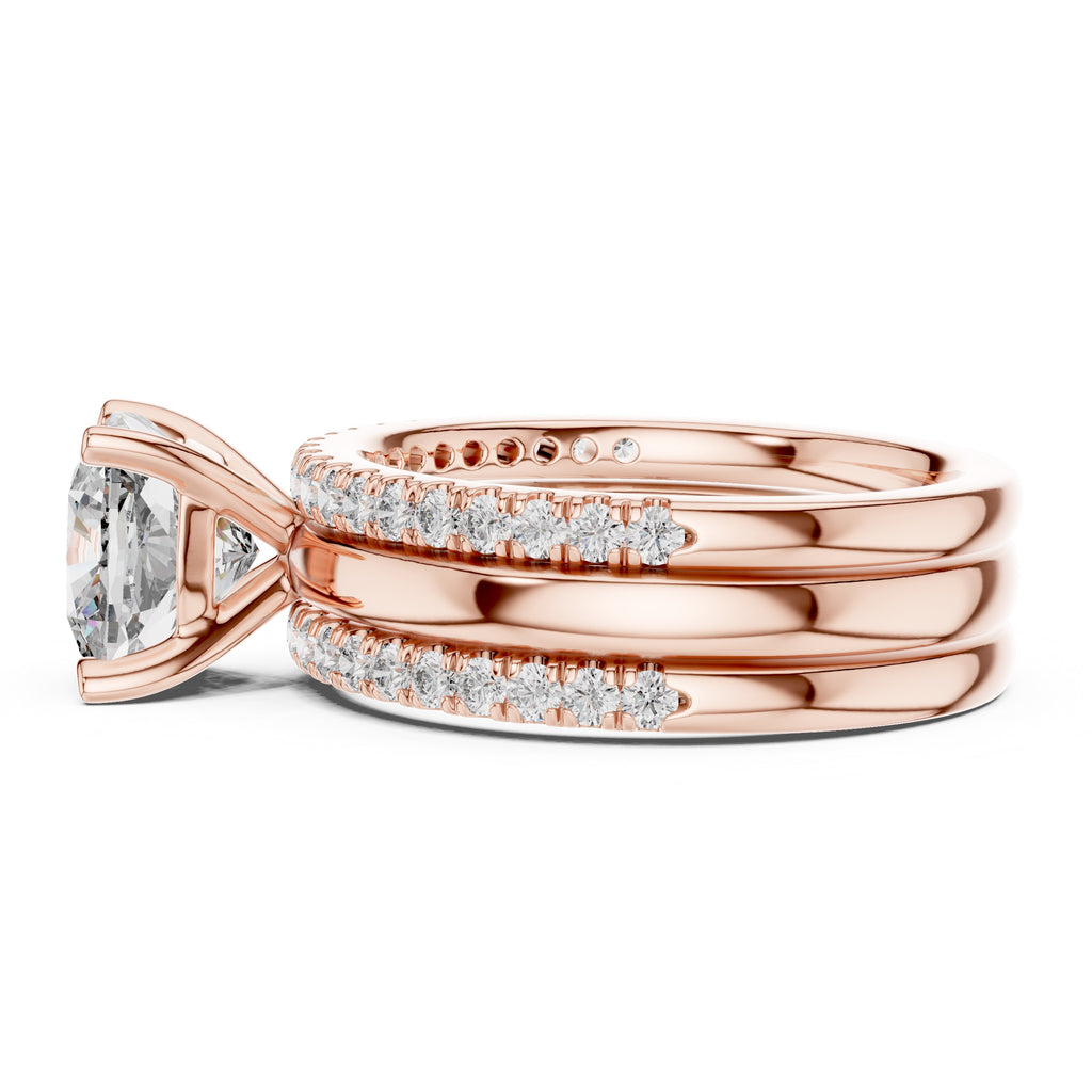 Rose gold ring with diamond accents on a white background