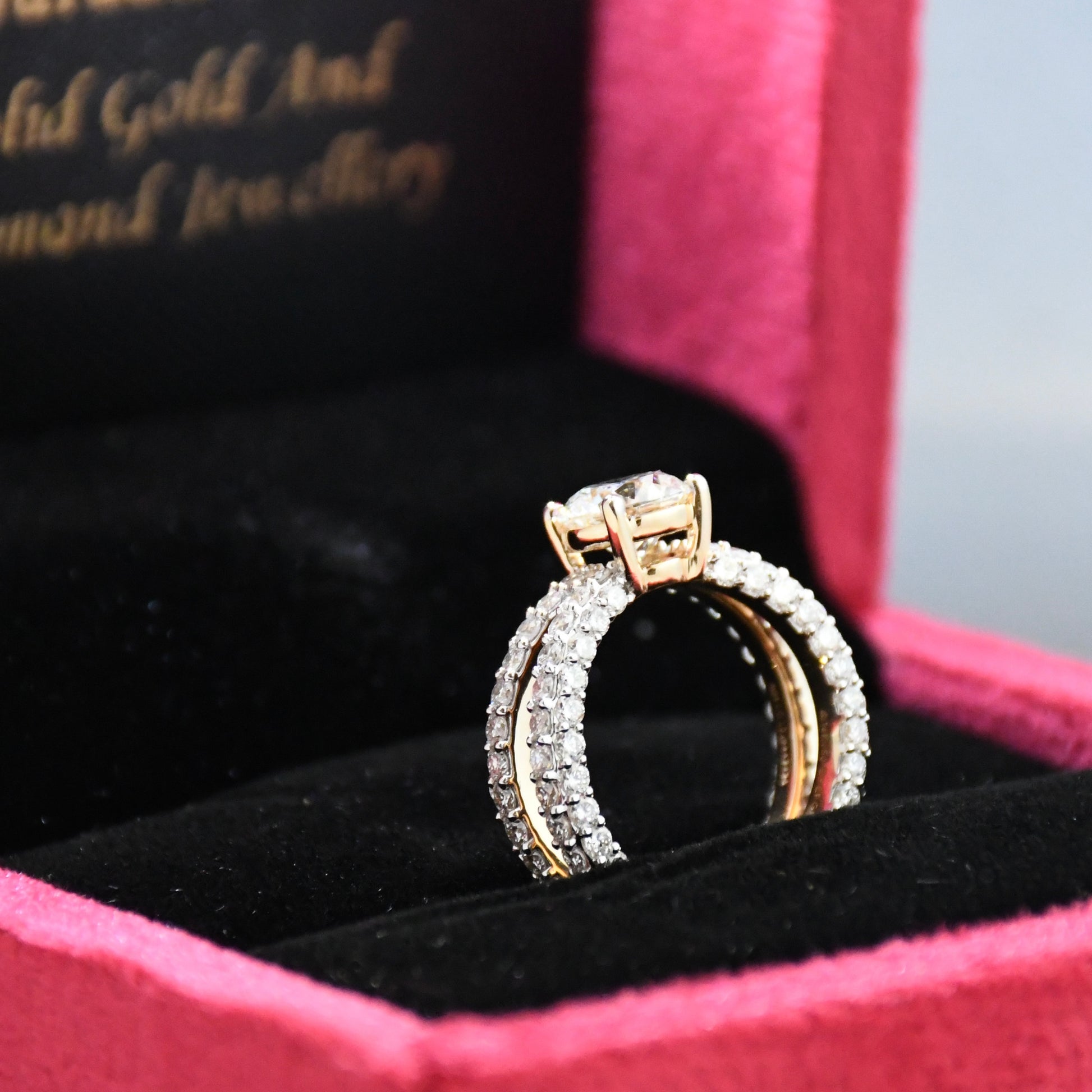 Gold and real diamond ring in a jewelry box with 'Gold and Diamond Jewelry' text.