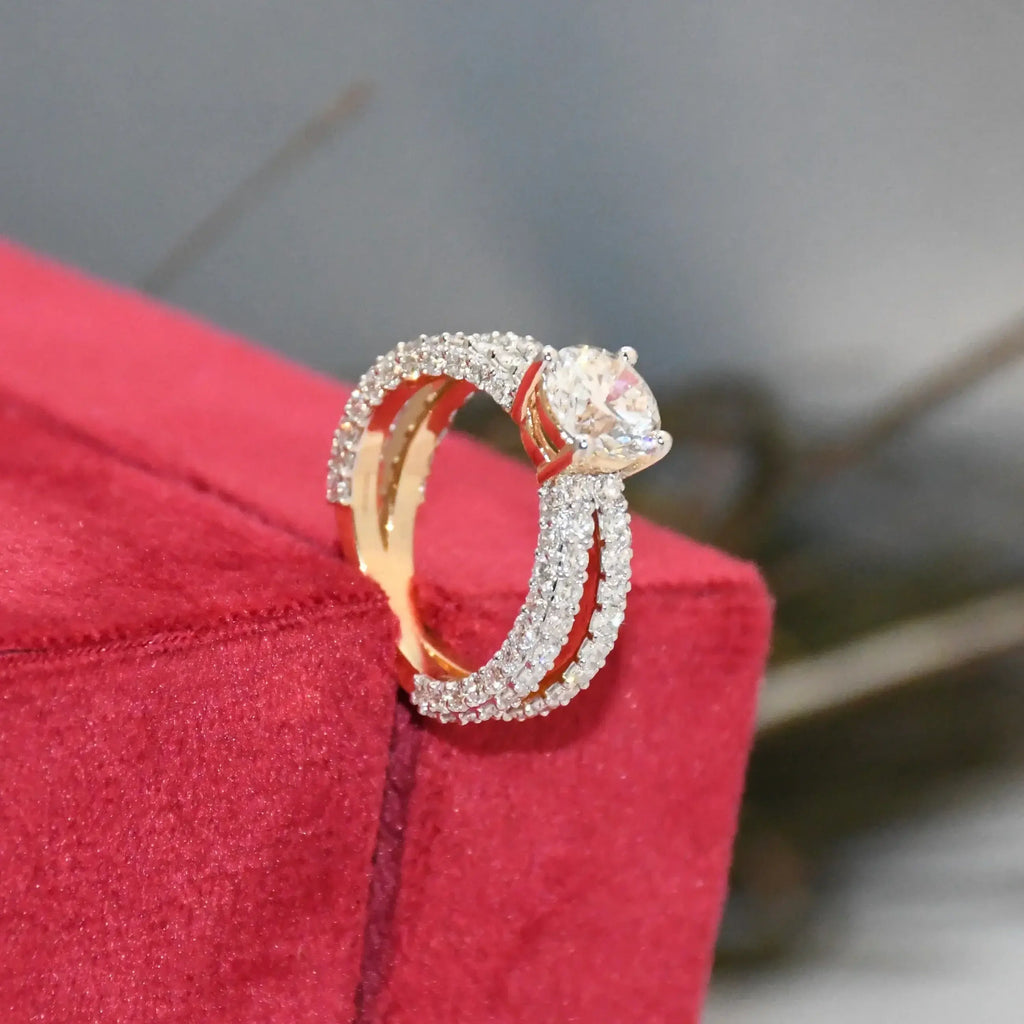 Gold and real diamond ring on a red jewelry box with a blurred background