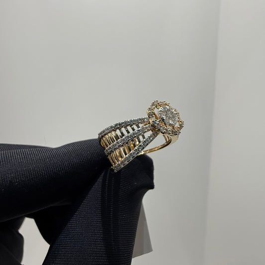 Elegant gold diamond ring featuring a round-cut central diamond surrounded by a halo of smaller diamonds, set on a split shank band adorned with rows of sparkling pavé diamonds, displayed on a black gloved hand against a neutral background.