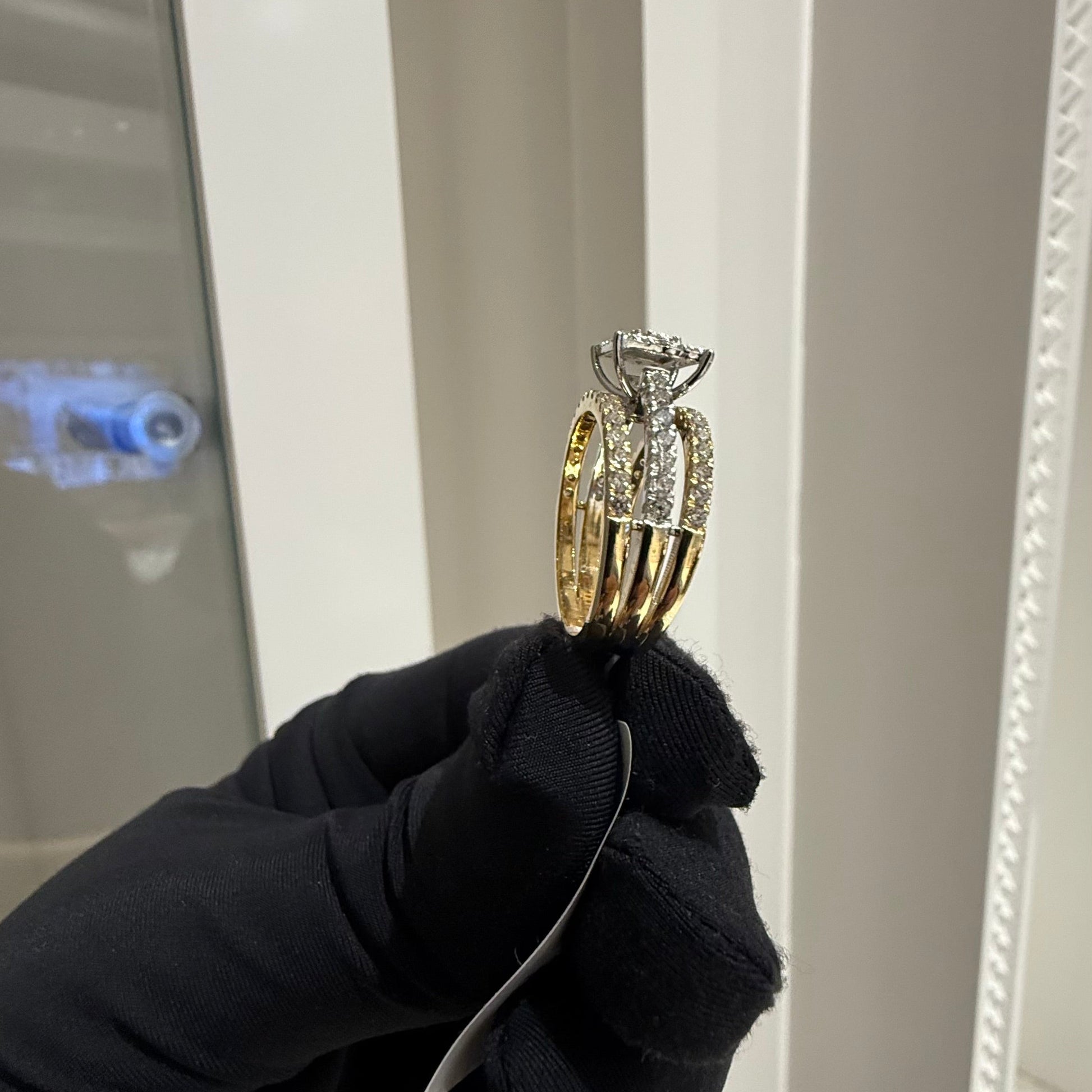 A close-up image of a handcrafted natural diamond ring set in 14kt solid gold, showcasing the band with embedded diamonds.