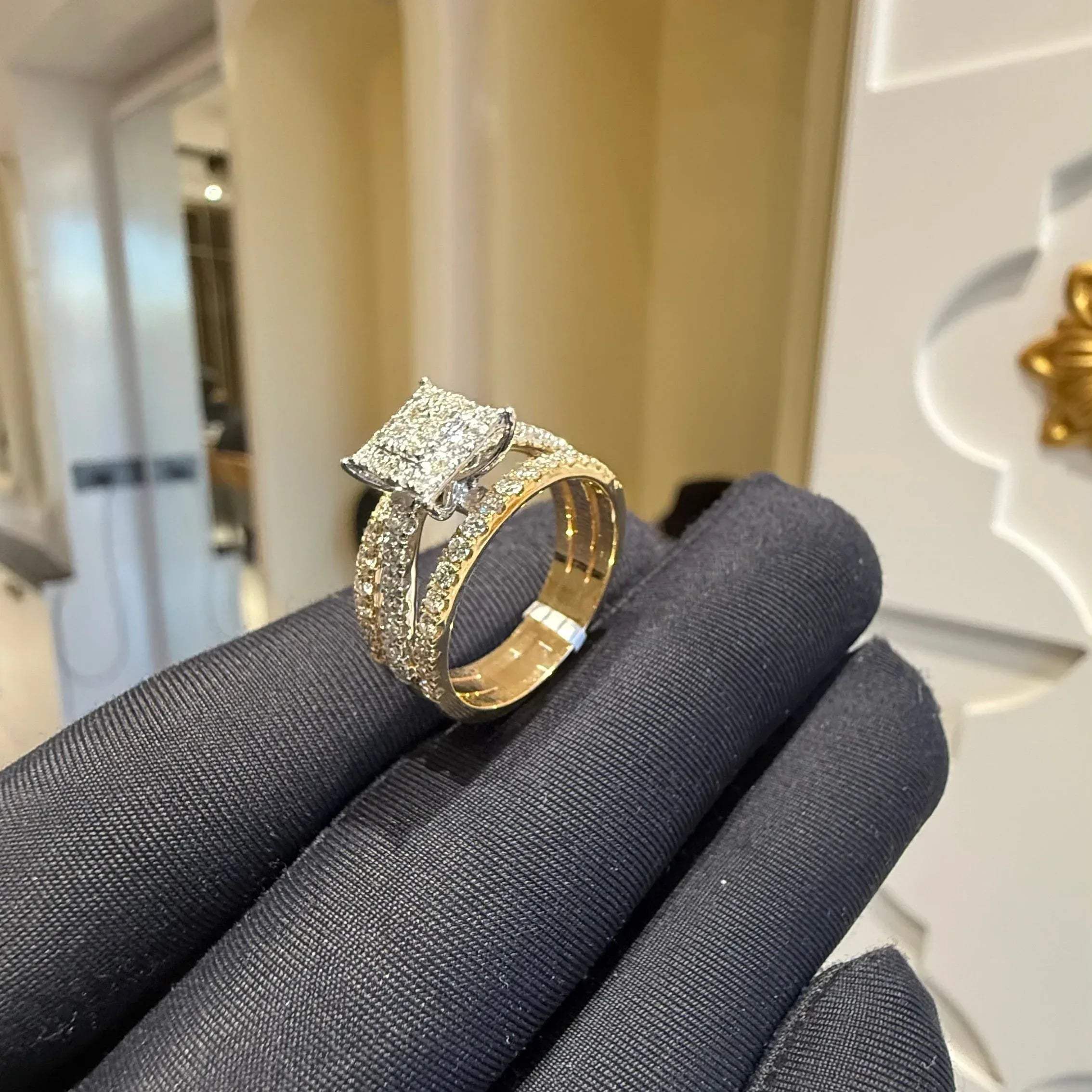 A close-up image of a handcrafted natural diamond ring set in 14kt solid gold, showcasing the band with embedded diamonds.