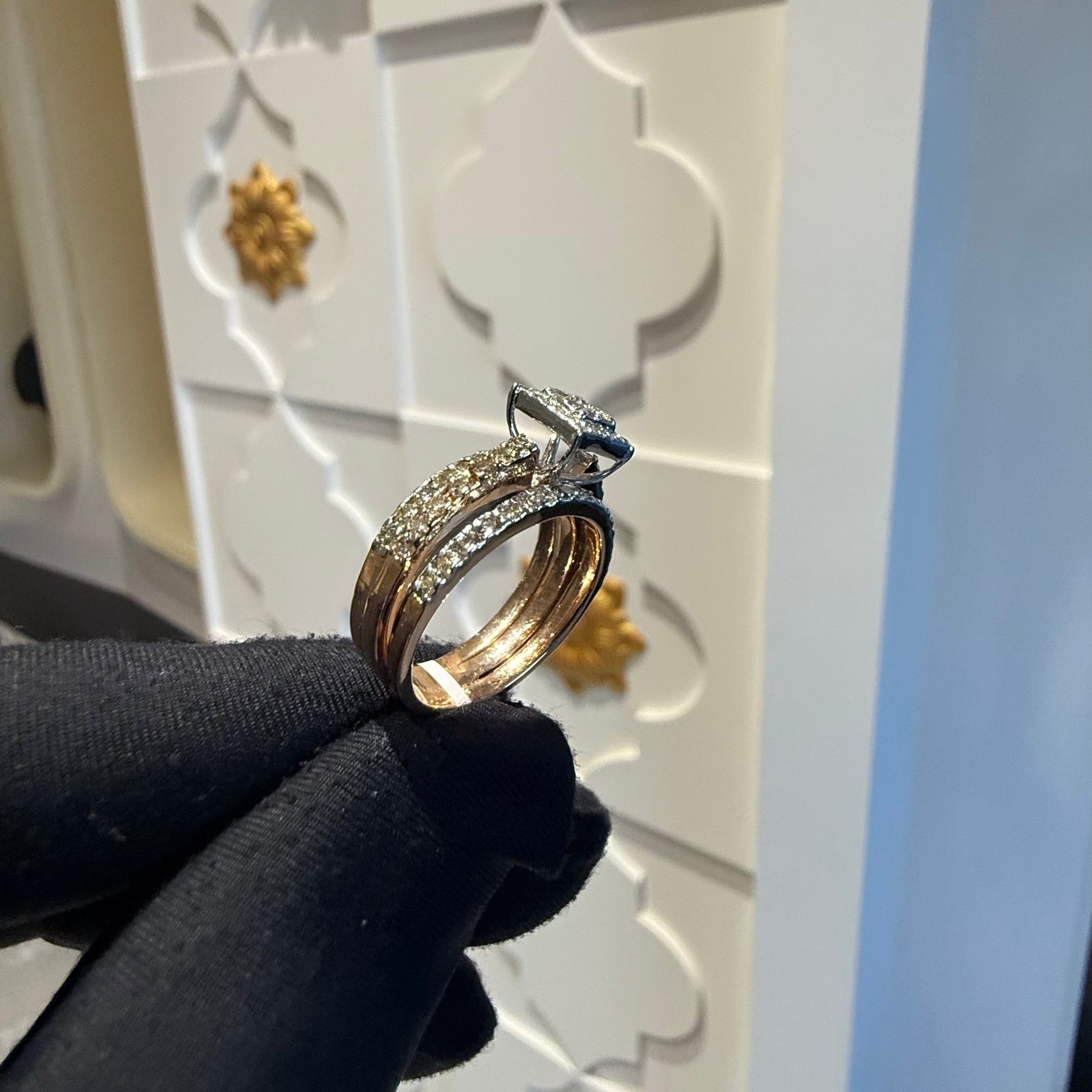 A close-up image of a handcrafted natural diamond ring set in 14kt solid gold, showcasing the band with embedded diamonds.