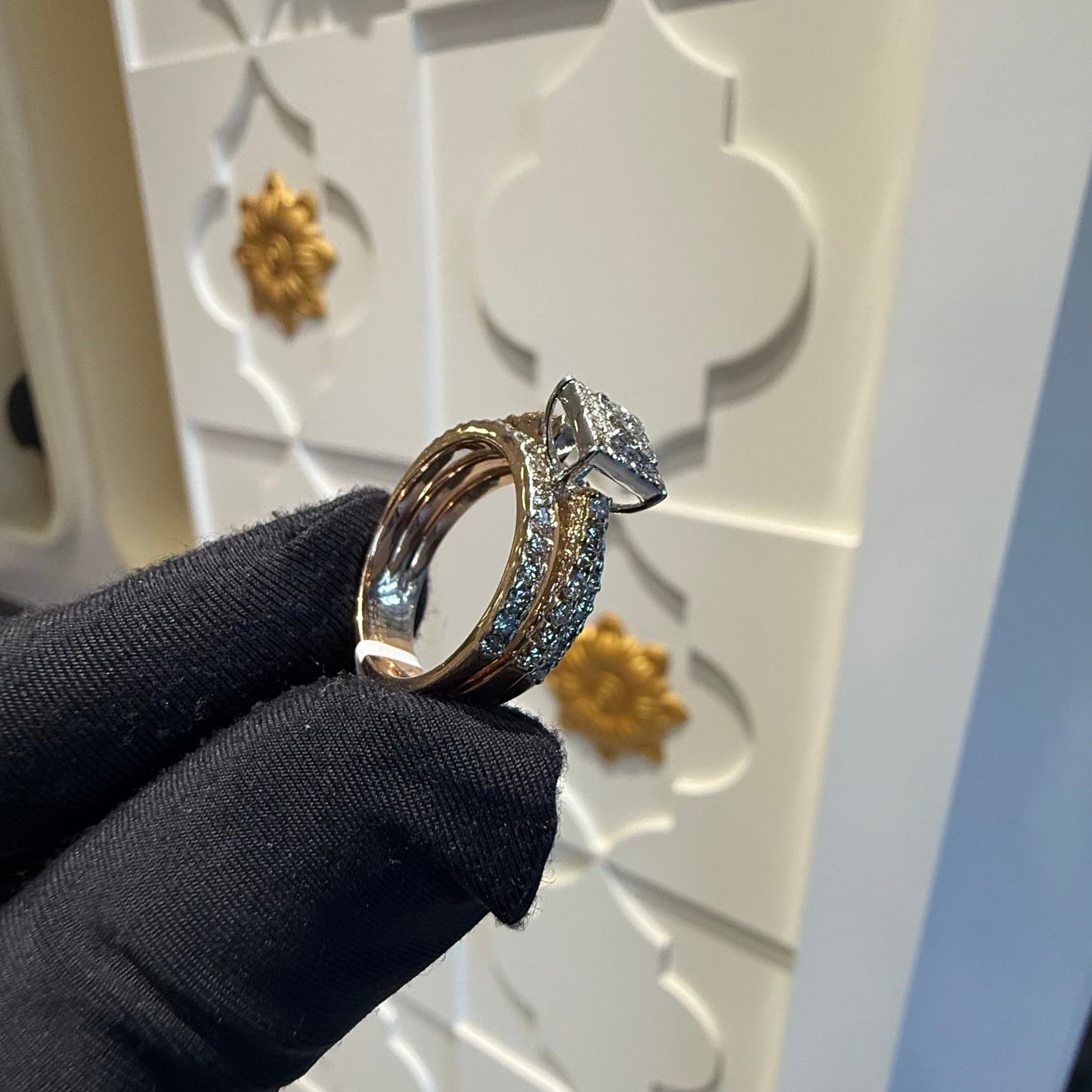 A close-up image of a handcrafted natural diamond ring set in 14kt solid gold, showcasing the band with embedded diamonds.