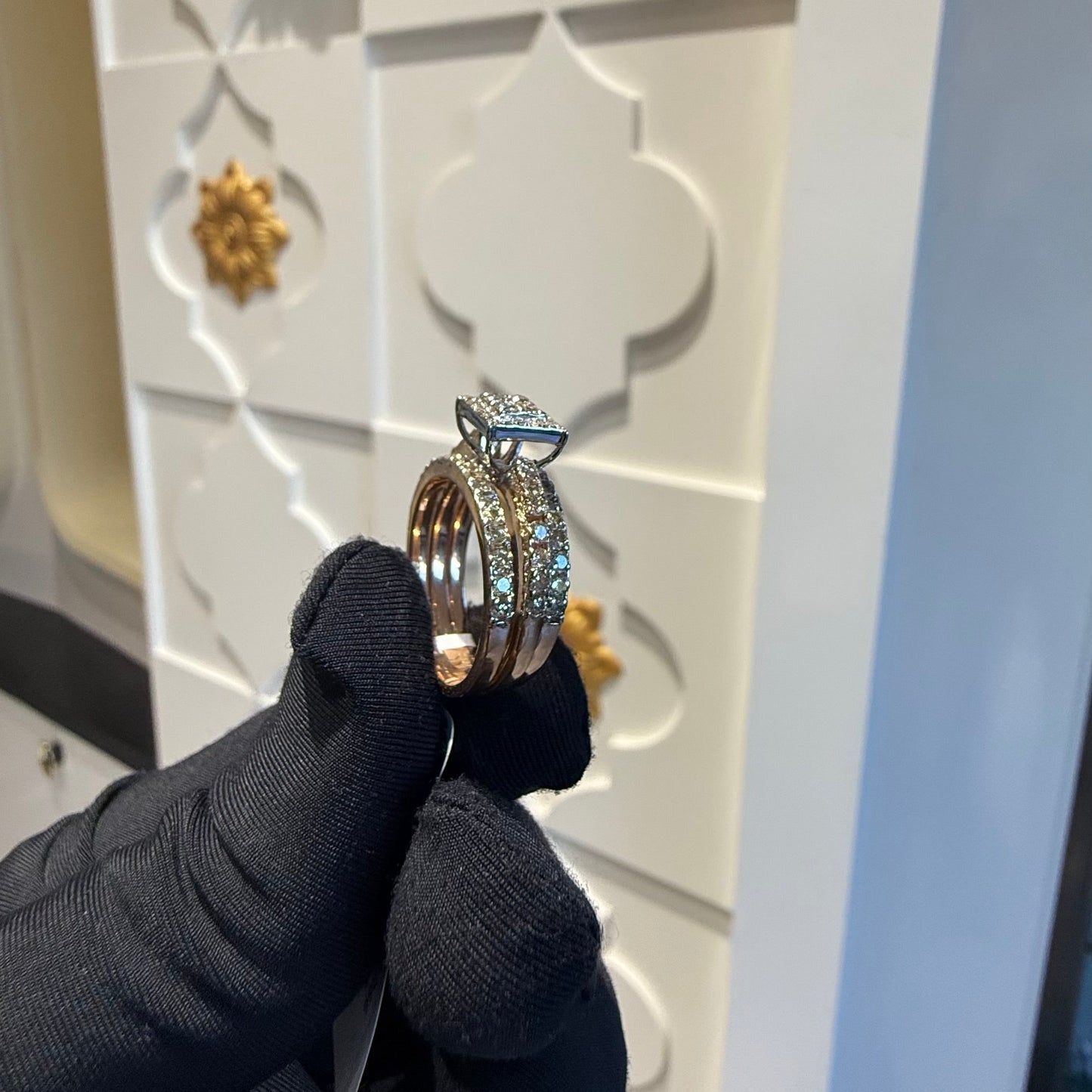 A close-up image of a handcrafted natural diamond ring set in 14kt solid gold, showcasing the band with embedded diamonds.