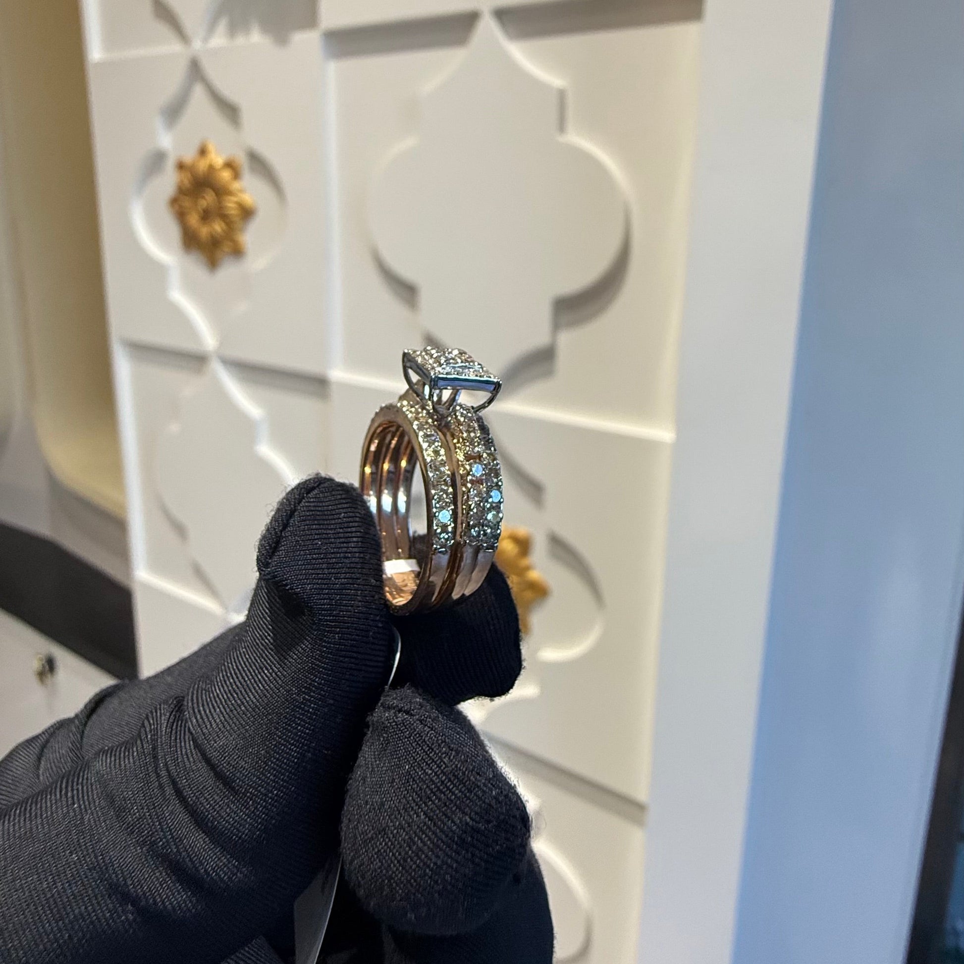 A close-up image of a handcrafted natural diamond ring set in 14kt solid gold, showcasing the band with embedded diamonds.