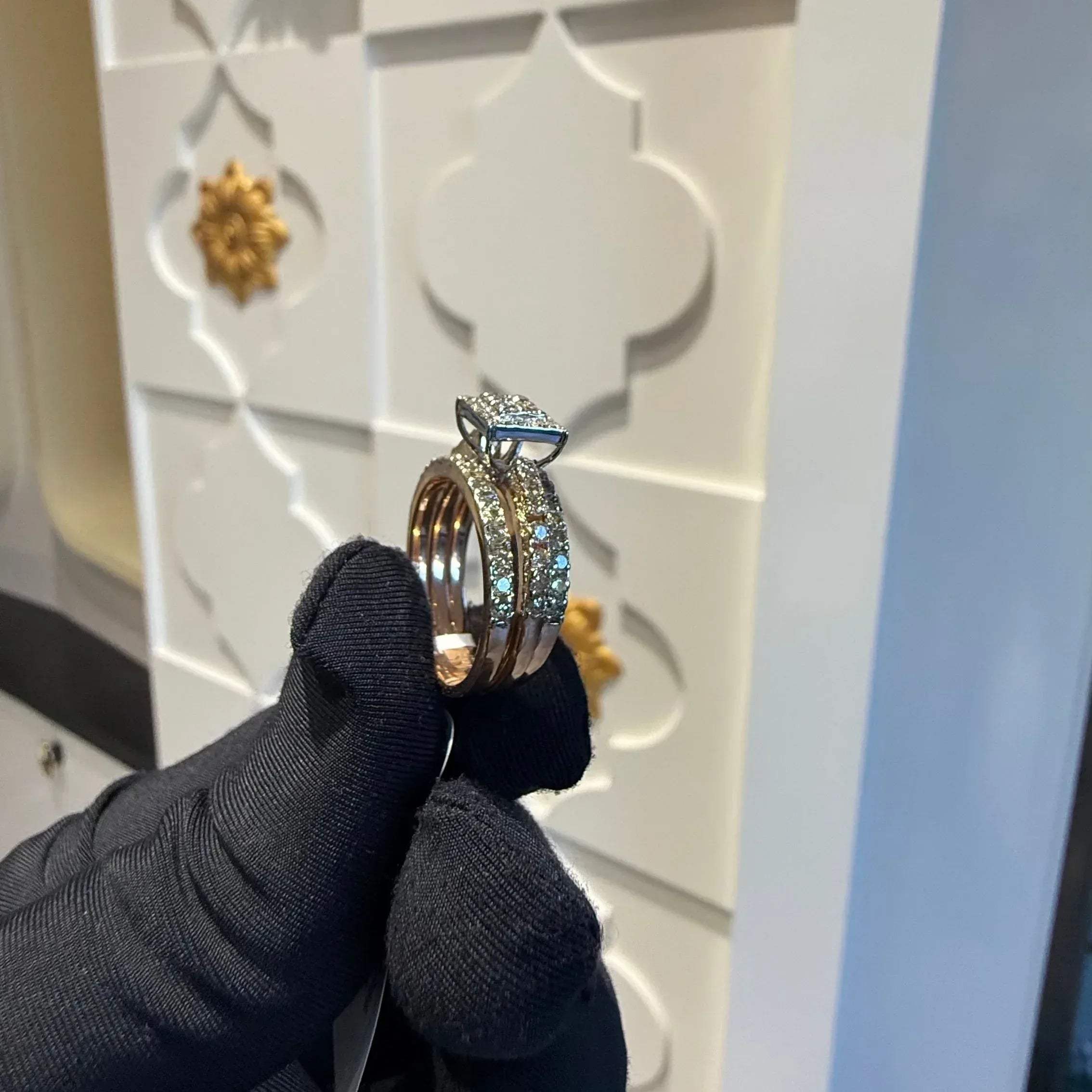 A close-up image of a handcrafted natural diamond ring set in 14kt solid gold, showcasing the band with embedded diamonds.