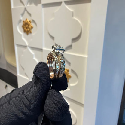 A close-up image of a handcrafted natural diamond ring set in 14kt solid gold, showcasing the band with embedded diamonds.