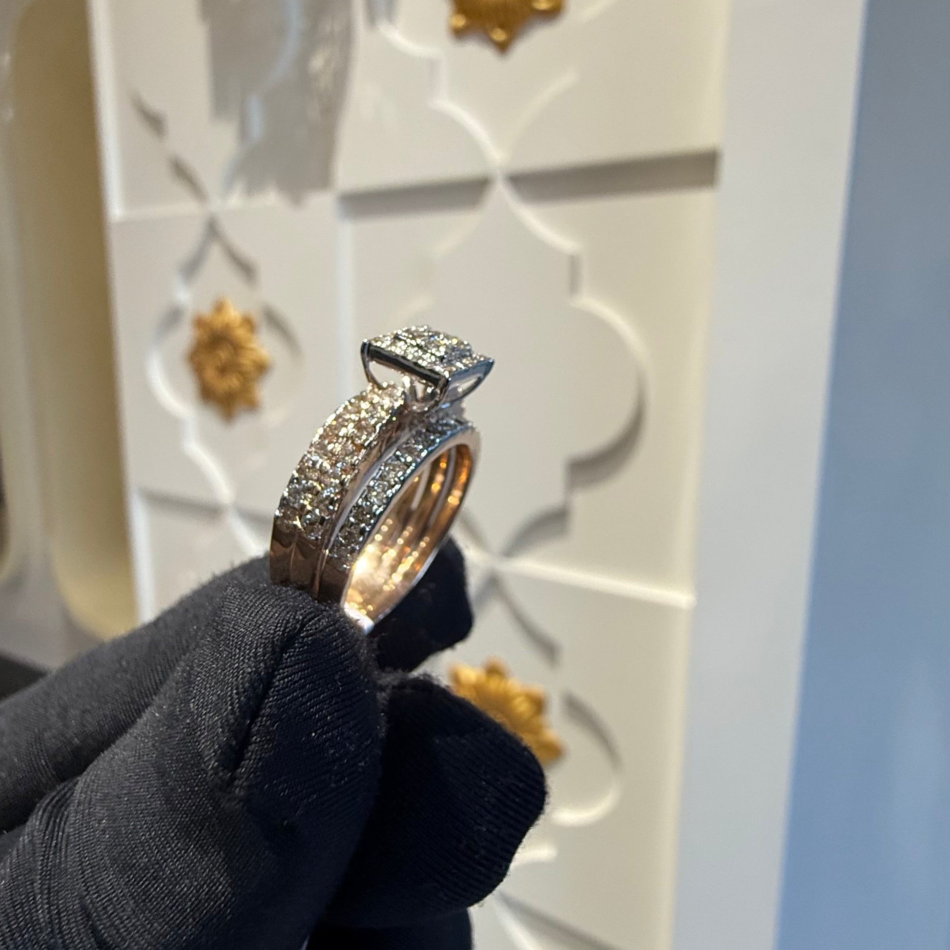 A close-up image of a handcrafted natural diamond ring set in 14kt solid gold, showcasing the band with embedded diamonds.