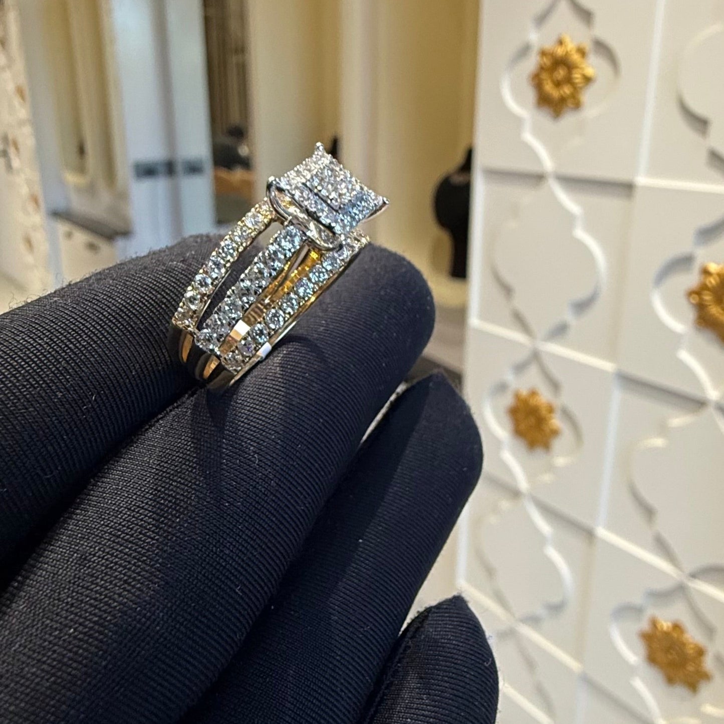 A close-up image of a handcrafted natural diamond ring set in 14kt solid gold, showcasing the band with embedded diamonds.