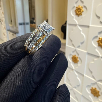 A close-up image of a handcrafted natural diamond ring set in 14kt solid gold, showcasing the band with embedded diamonds.
