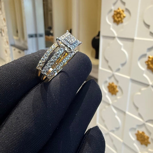 A close-up image of a handcrafted natural diamond ring set in 14kt solid gold, showcasing the band with embedded diamonds.