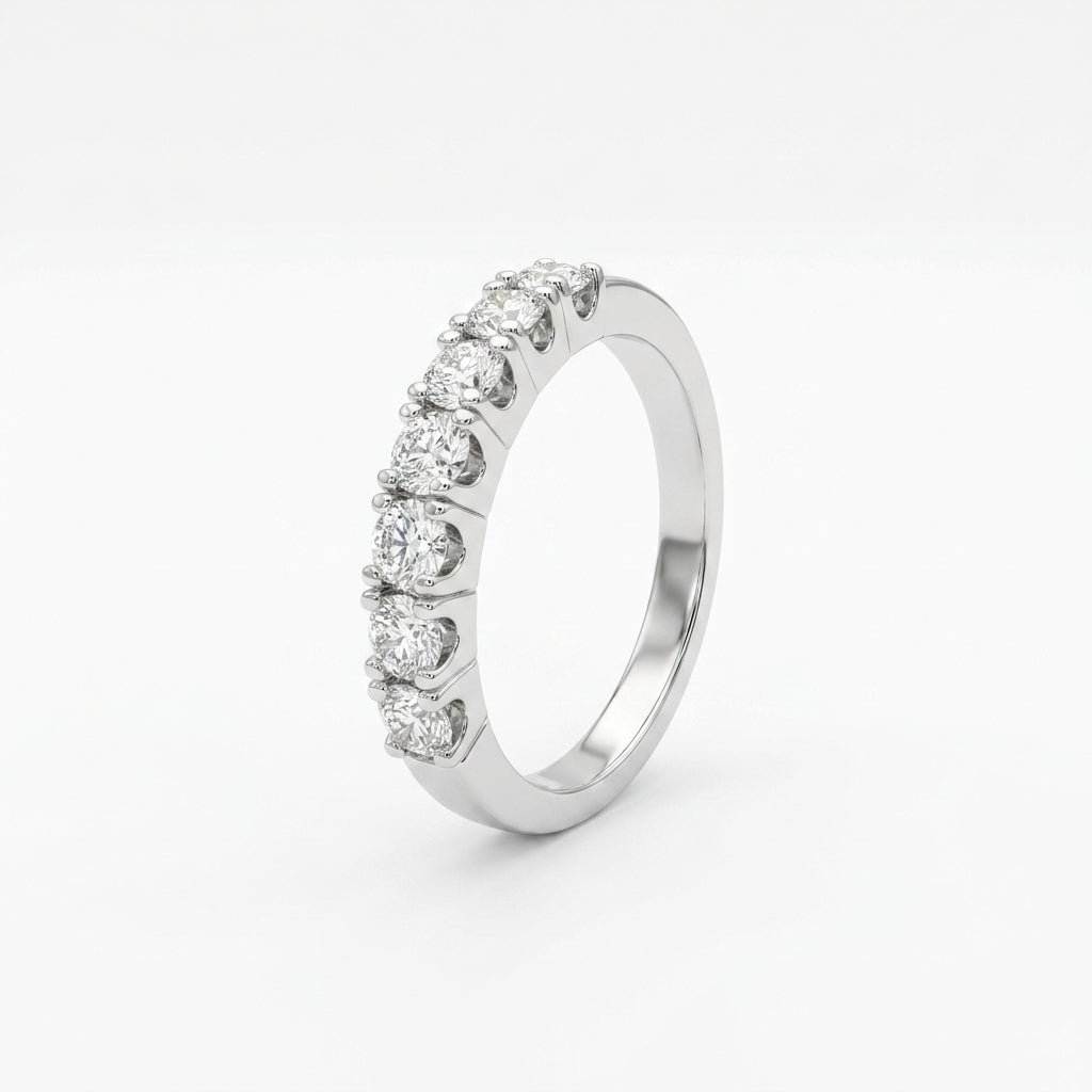 A band diamond ring with multiple diamonds set in a gold band, displayed against a white background.