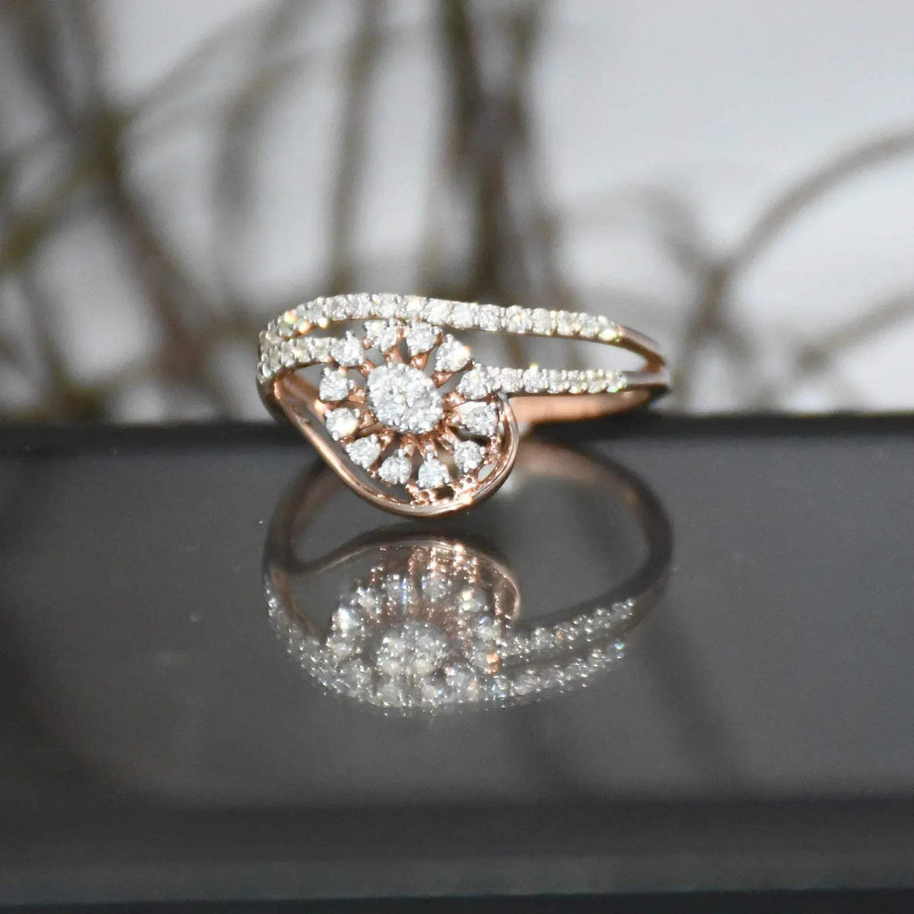 gold ring with diamonds on a reflective surface
