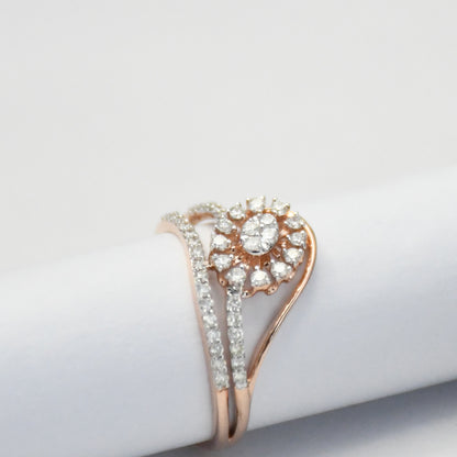 gold ring with diamond accents on a light gray background