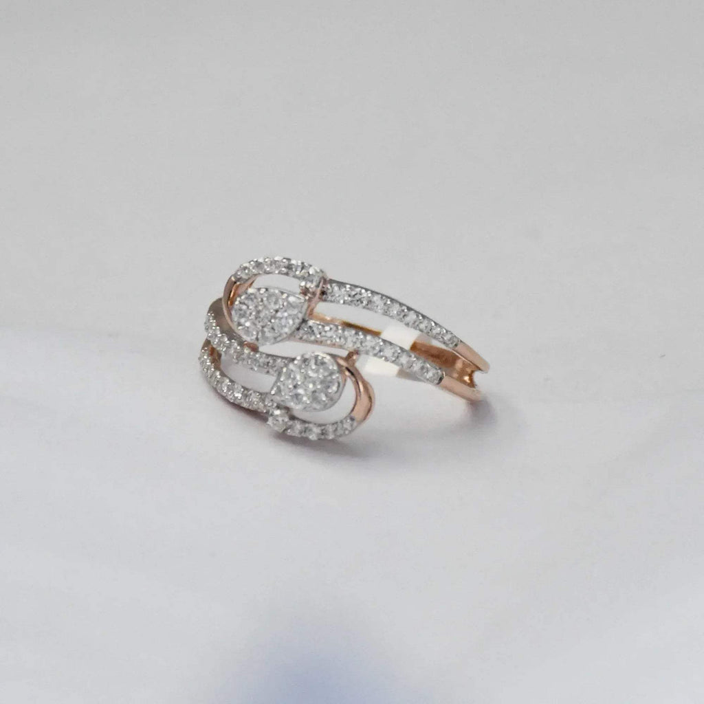 Rose gold ring with diamonds on a light gray background