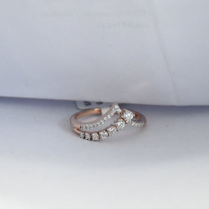 Rose gold ring with diamonds on a white background