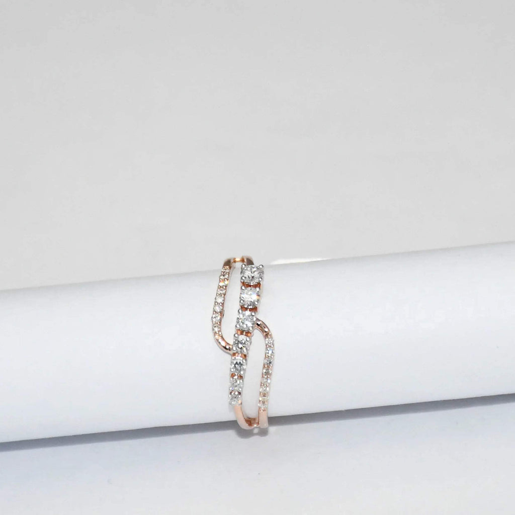 gold ring with diamonds on a white surface