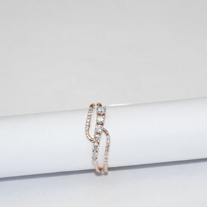gold ring with diamonds on a white surface