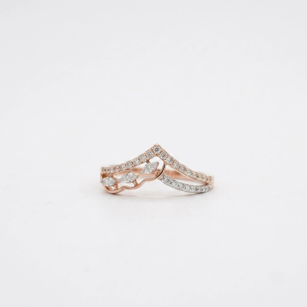 A delicate rose gold diamond ring set with diamonds, photographed on a clean white background.