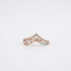 A delicate rose gold diamond ring set with diamonds, photographed on a clean white background.