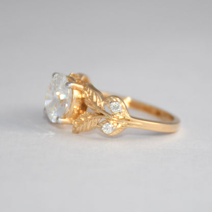 Gold ring with a diamond on a light gray background