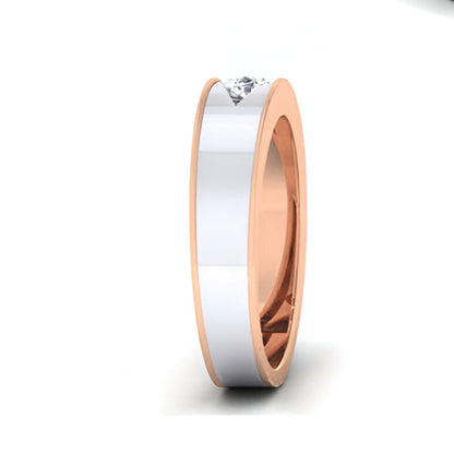 Two-tone ring with a diamond on a white background