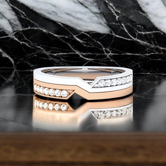 Two-tone ring with diamonds on a marble surface