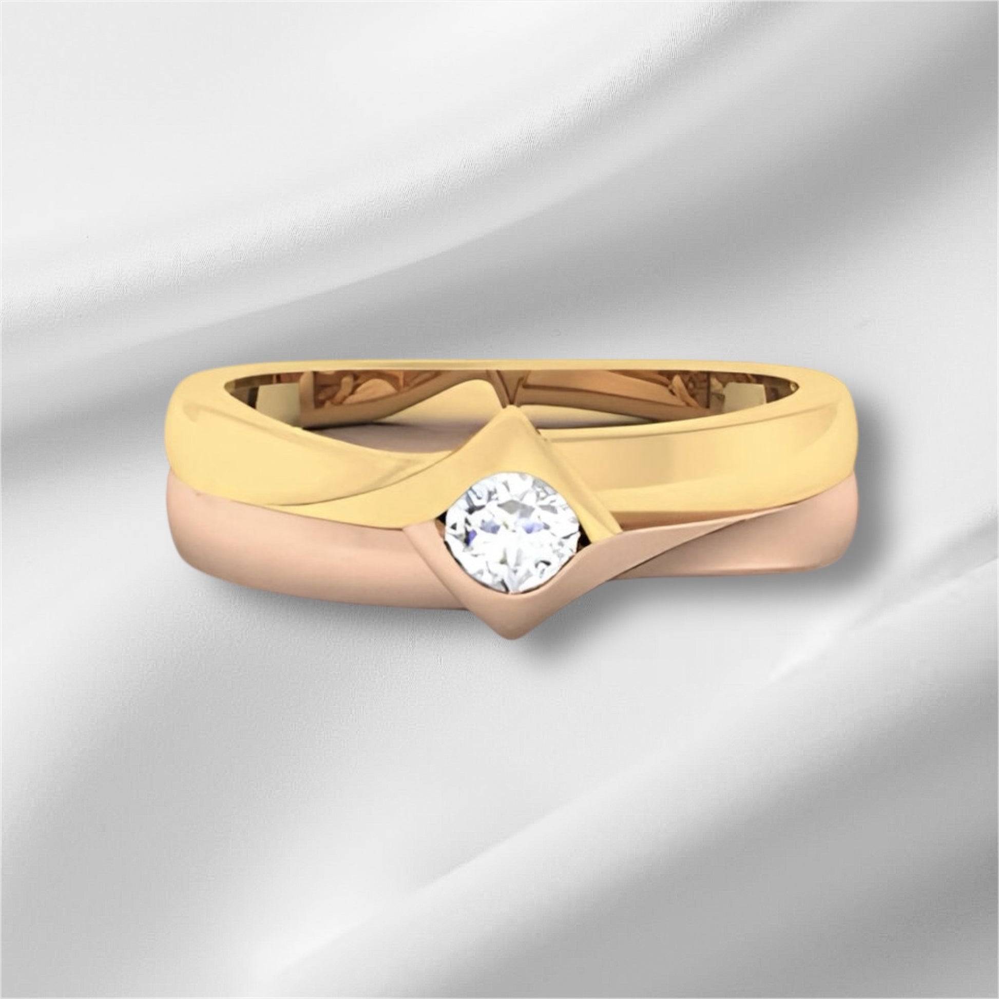 two tone gold ring with a diamond on a light gray background