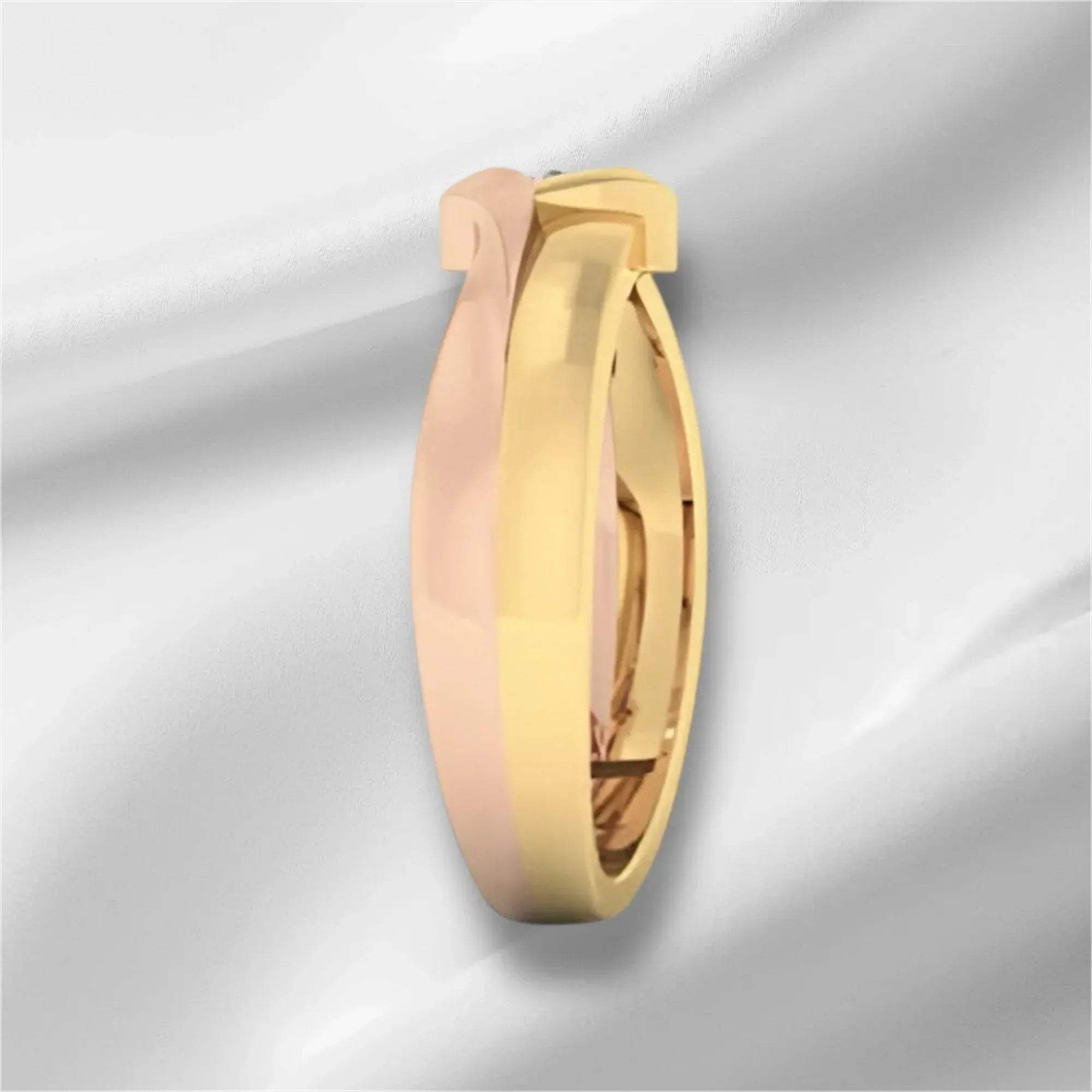 two tone gold diamond ring on a light gray background