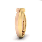 Two tone gold ring with a diamond on a white background